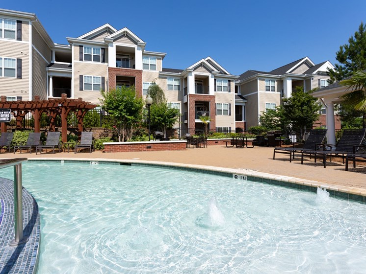 Swimming Pool With Sparkling Water at Abberly Village Apartment Homes by HHHunt, South Carolina